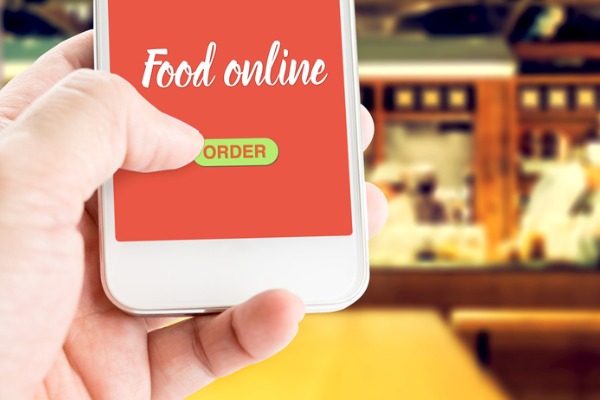 hand holding mobile ordering food