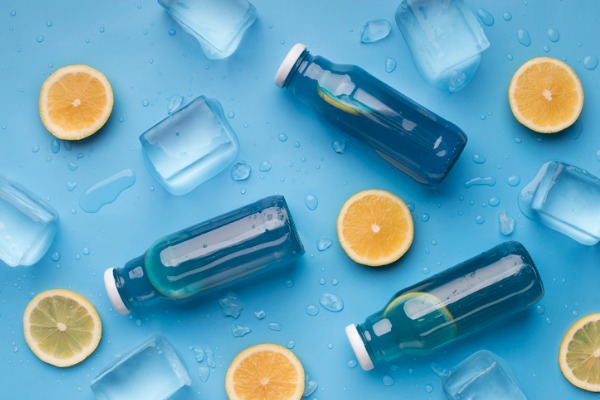 sports drinks with real fruits blue background